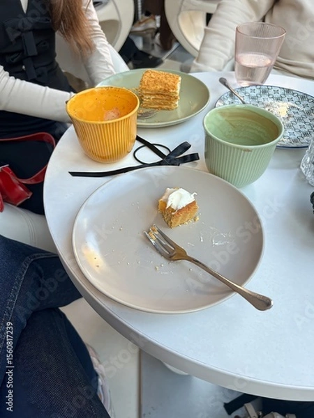 Obraz Friends Having Dessert and Coffee at Café Table