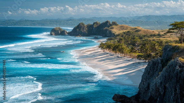 Fototapeta View of Sumbaâ€™s Lailiang Beach with crashing waves, karst cliffs, and soft white sands under a blue sky