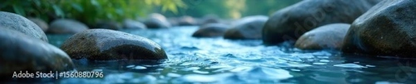 Obraz Serene Blue Water Flowing Over Smooth Stones Calming Relaxation for Wellness, Spa, and Meditation