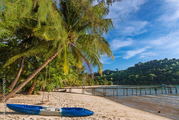 Fototapeta Beautiful landscape with kayak and palm trees and low tide sea at Bang Bao Bay, Koh Kood island