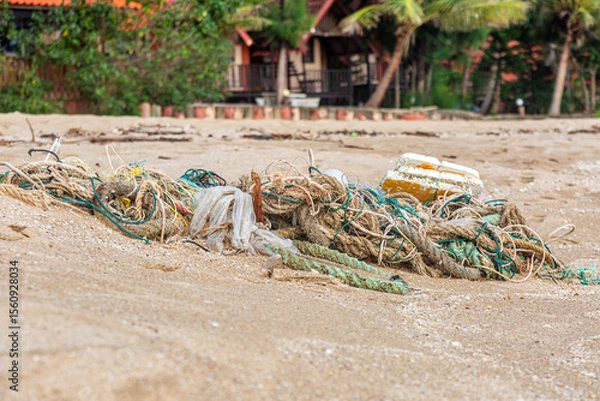 Fototapeta Outdoor view of fishing net and ropes garbage