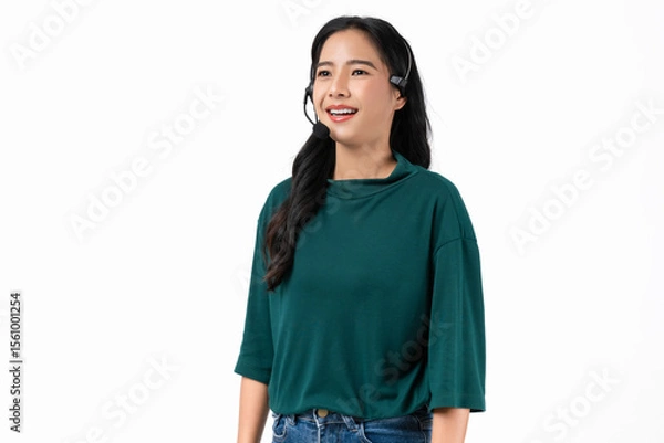 Fototapeta Cheerful beautiful Asian woman consultant wearing microphone headset of customer support phone operator at workplace on white background.