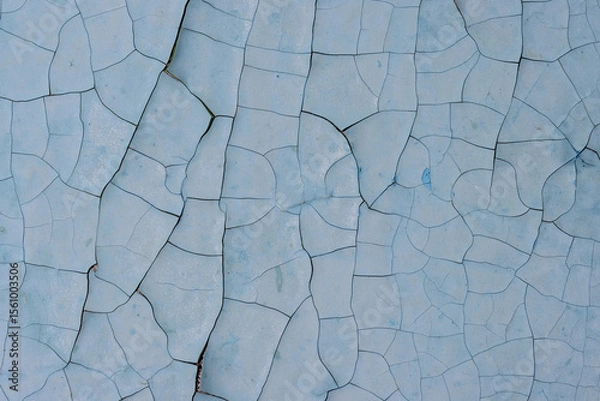 Fototapeta Peeling paint on the wall. Old concrete wall with cracked flaking paint. Weathered rough painted surface with patterns of cracks and peeling. High resolution texture for background and design. Closeup