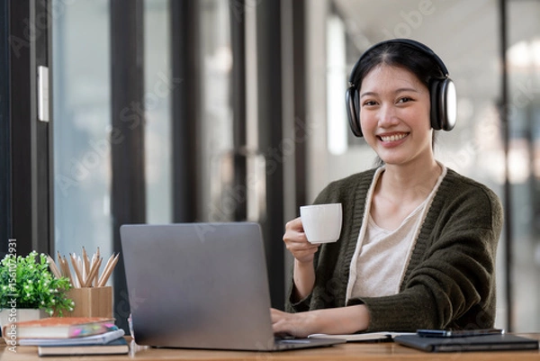 Obraz Hipster teen girl school student wear headphone watch video online webinar learn on laptop elearning course video conference pc call in library