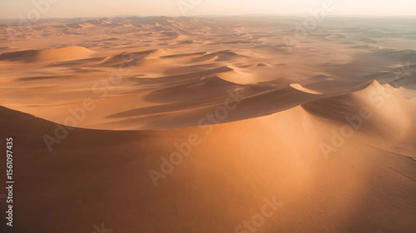 Fototapeta Aerial drone footage of desert sand dunes with natural textures and long shadows