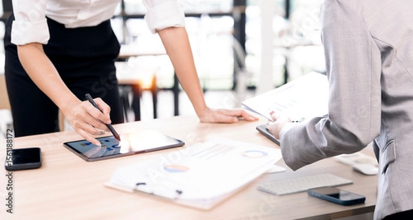 Obraz Business people  planning analyze investment and marketing on tablet in office.