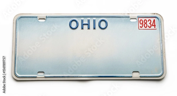 Fototapeta A vintage Ohio license plate with blue text on a faded blue background reads A red and white sticker displays "Text Space" in the top right