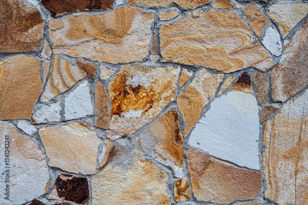 Fototapeta Texture of wall lined with natural stone. Template, background or wallpaper sample.