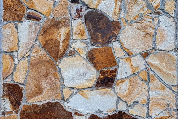 Fototapeta Texture of wall lined with natural stone. Template, background or wallpaper sample.