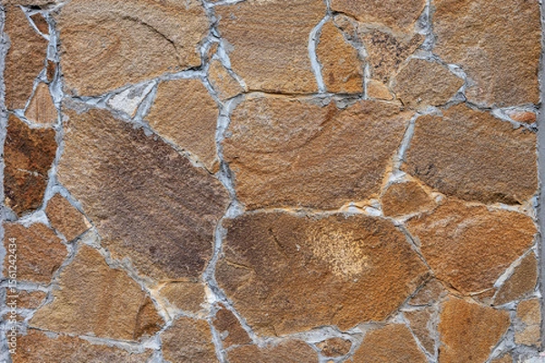 Fototapeta Texture of wall lined with natural stone. Template, background or wallpaper sample.