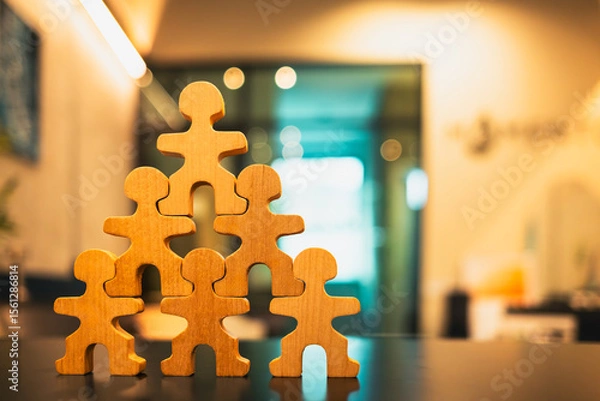 Fototapeta Person model standing on another man who was an employee The concept of Teamwork of bosses, empowerment and inspiration for crowd. Leader with influence, leadership.
