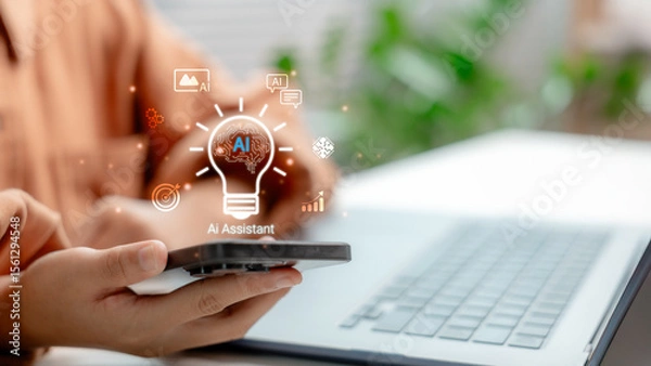 Obraz Person using smartphone with AI assistant icon overlay, symbolizing artificial intelligence technology, digital innovation, and smart virtual assistant for productivity.