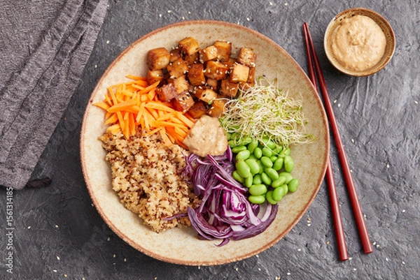 Fototapeta Quinoa edamame tofu bowl with red cabbage and carrots