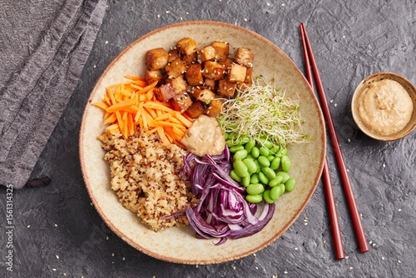 Fototapeta Quinoa edamame tofu bowl with red cabbage and carrots