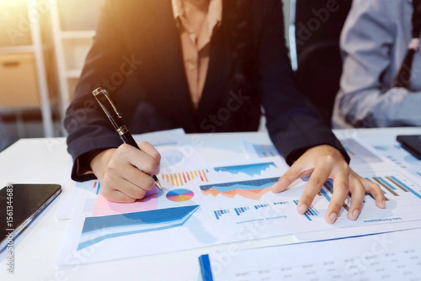 Fototapeta Team of business people working together in the meeting room office, teamwork background charts and graphs banner, double exposure successful teamwork,business planning concept.