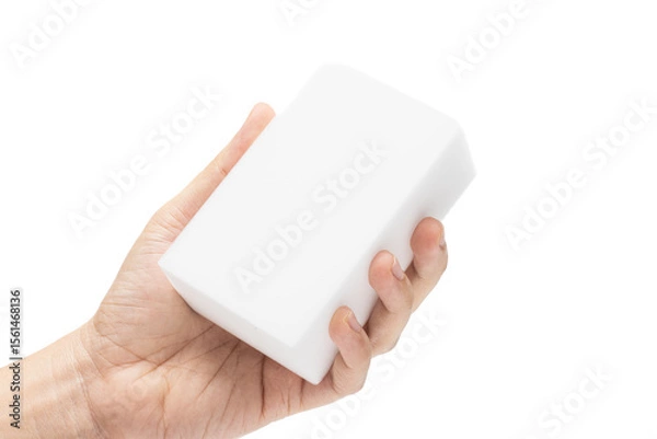 Obraz Hand holding melamine sponge or melamine foam, also known as magic sponge. a cleanig tool. isolated in white background.