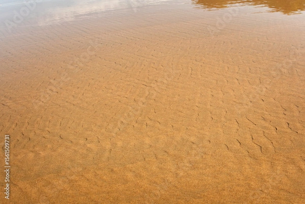 Obraz waves crash on the beach sand for background