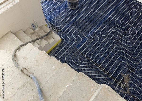 Fototapeta Floor heating installation in a new building, plastic pipes and pipelines. Modern heating system