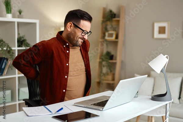 Obraz Man working from home suffering backache
