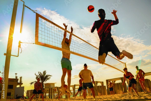 Fototapeta silhouette of beach Volleyball player on the beach in sunset
