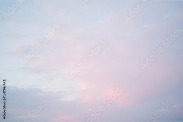 Fototapeta View of a cloudy sky with a pink cloud in the middle