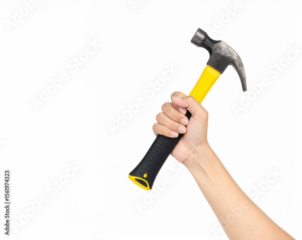 Fototapeta Hand Holding Yellow Hammer Isolated on White Background – Concept of Manual Labor, Construction Work, Repair Tools, and Home Renovation DIY Equipment