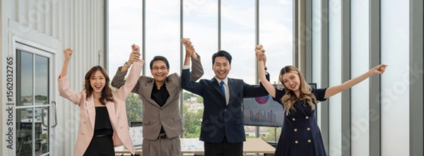 Fototapeta Happy business team making high hands for business teamwork concept, large group of people celebrating.