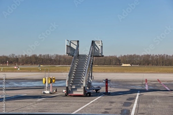 Fototapeta Airplane ground handling stairs standing unused, empty