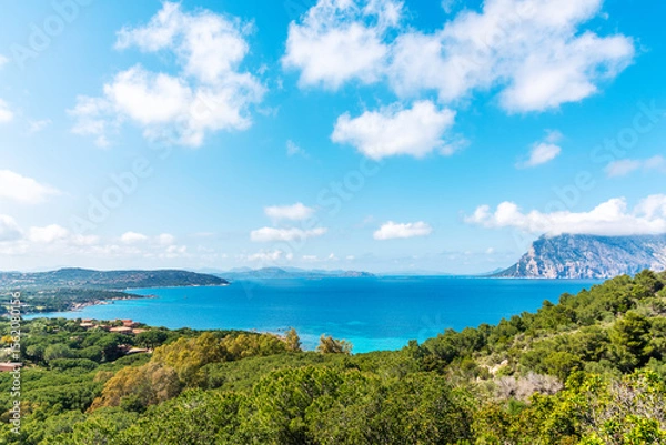 Fototapeta Panoramic view of Capo Coda Cavallo under a cloudy sky