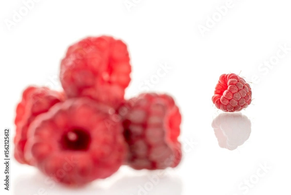 Fototapeta Fresh sweet raspberries isolated on white background, macro.