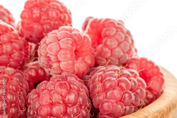 Fototapeta Fresh sweet raspberries isolated on white background, macro.