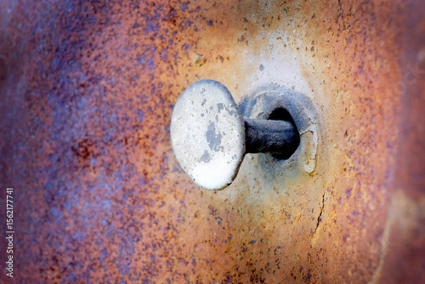 Obraz Rusty Metal with a Nail Sticking Out of Hole