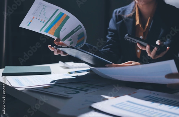 Obraz Two business people analyzing the data