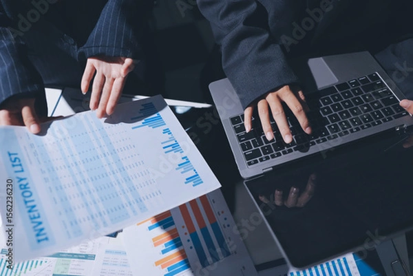 Obraz Two business people analyzing the data