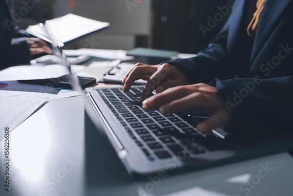 Obraz Group of business women working on a financial data expenses document.