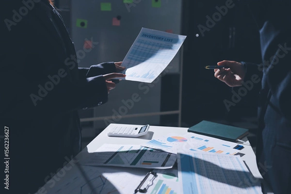 Obraz Group of business women working on a financial data expenses document.