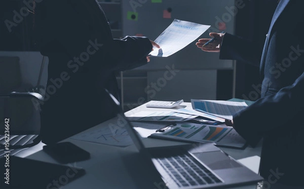 Obraz Group of business women working on a financial data expenses document.