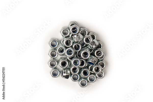 Obraz A group of metal nuts isolated on a white background.