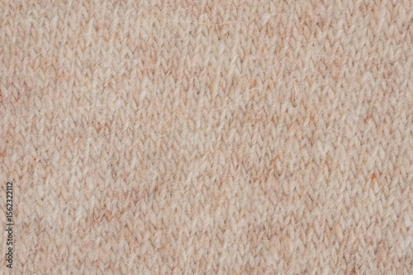 Obraz Knitted fabric with soft texture in warm beige color suitable for winter wear