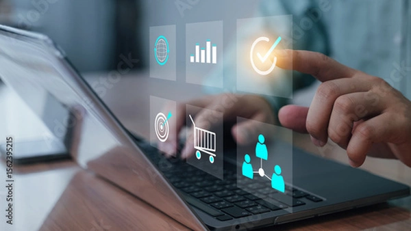 Fototapeta Hand and laptop with a futuristic virtual interface, touching digital icons such as data analytics, checklists, and communication features. digital transformation business technology, innovation.