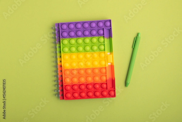 Obraz Back to school concept. Border made of school supplies on green background. Top view. Copy space