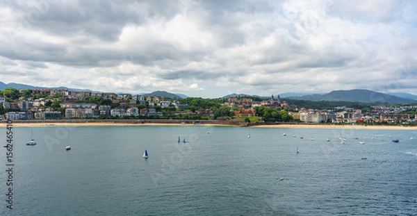 Fototapeta Aerial view of the bay of La Concha in San Sebastian, with the houses on the edge of the sea, Spain.