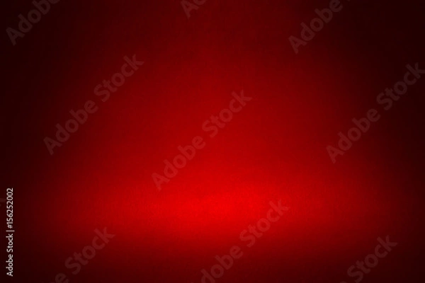 Fototapeta spotlight on a dark red material abstract background