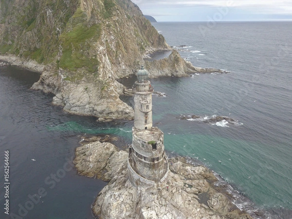 Fototapeta An old abandoned lighthouse from a close view.