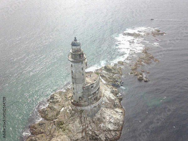 Fototapeta An old abandoned lighthouse from a close view.