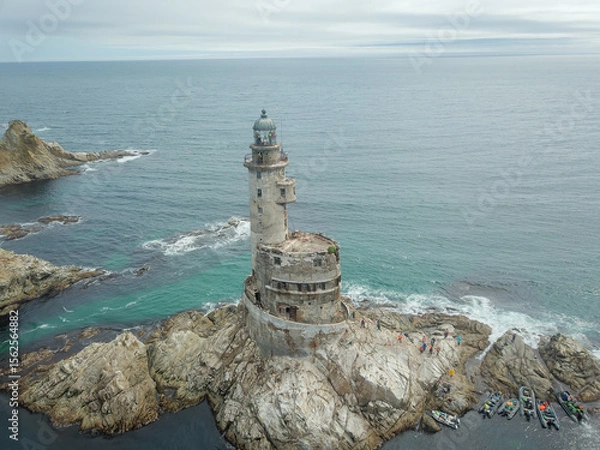 Fototapeta An old abandoned lighthouse from a close view.