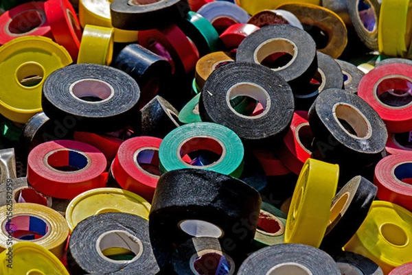 Obraz Large pile of colorful insulated tapes sold outside on flea market stall