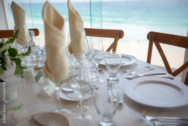 Fototapeta elegant banquet tables prepared for a conference or a party indoors