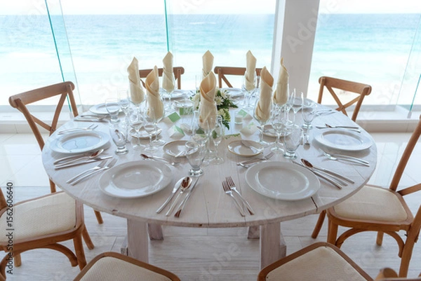 Fototapeta elegant banquet tables prepared for a conference or a party indoors