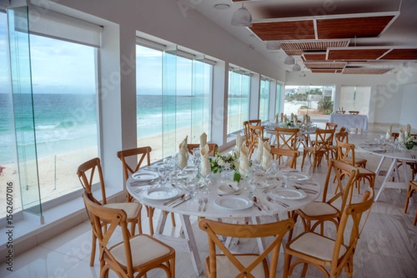 Fototapeta elegant banquet tables prepared for a conference or a party indoors